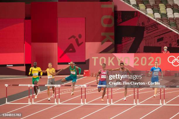 August 1: Alison dos Santos of Brazil winning from Abderrahman Samba of Qatar in the Men's 400m Hurdles Semi-Finals at the Olympic Stadium during the...