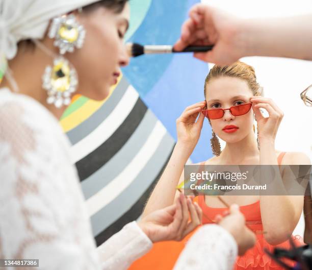 Models pose backstage ahead of the Giambattista Valli Womenswear Spring/Summer 2022 show as part of Paris Fashion Week on October 04, 2021 in Paris,...
