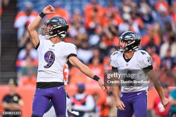 Justin Tucker and Sam Koch of the Baltimore Ravens watch the flight of a fourth quarter field goal against the Denver Broncos at Empower Field at...