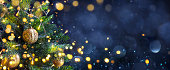 Christmas Tree In Blue Night - Golden Balls  With Bokeh Lights In Abstract Background