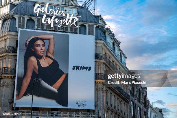 Giant poster with Kim Kardashian West is displayed at the 'Galeries Lafayette' department store on October 04, 2021 in Paris, France.