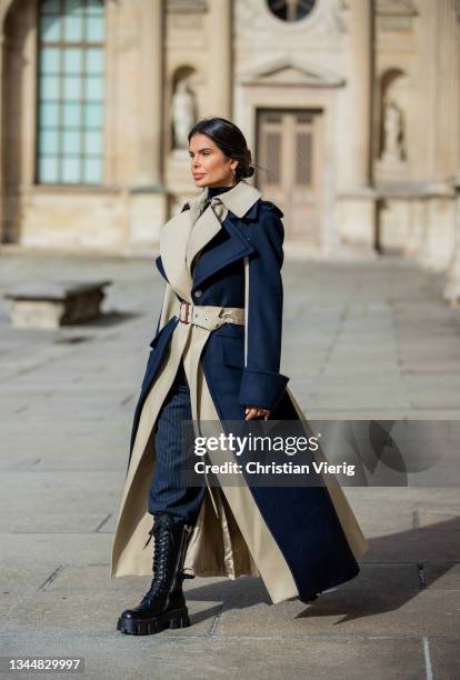 Victoria Barbara is seen wearing navy beige two tone coat Alexander McQueen, turtleneck YSL, Prada boots during Paris Fashion Week - Womenswear...