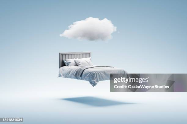 dreaming and sleeping concept. - getting out of bed stock-fotos und bilder