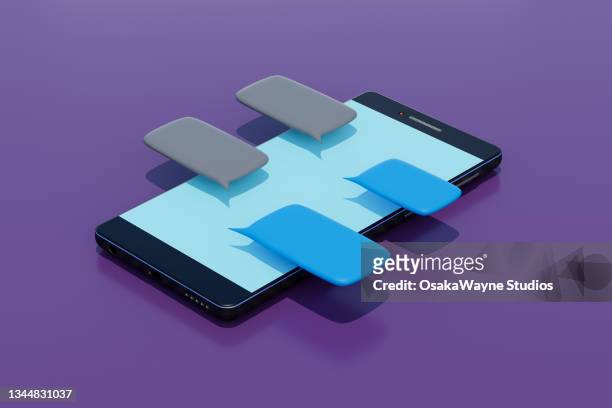 modern smartphone laying with colorful message bubbles above screen - chat stock-fotos und bilder