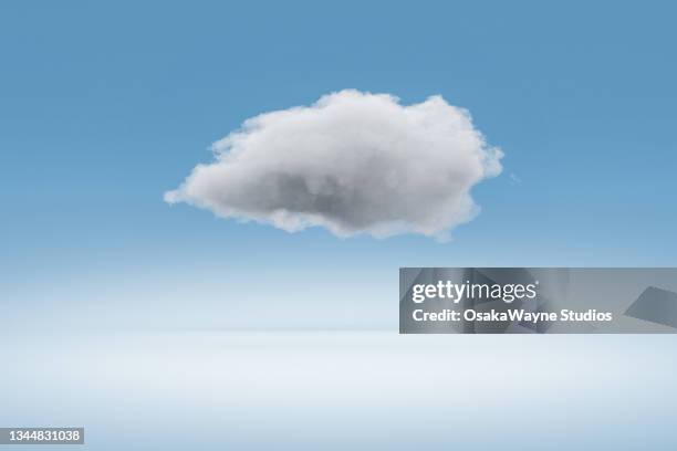 fluffy cloud against white and blue gradient background - cumulus stockfoto's en -beelden