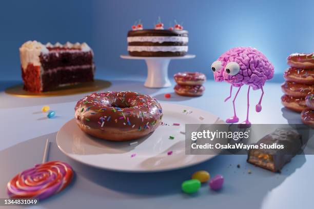 human brain walking between cookies, candies and other junk food - sugar food stock pictures, royalty-free photos & images