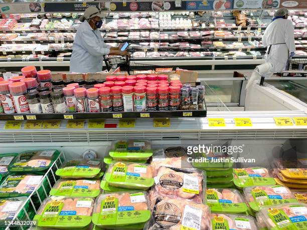 Packages of Foster Farms chicken are displayed on a shelf at a Safeway store on October 04, 2021 in San Francisco, California. The price for meat at...