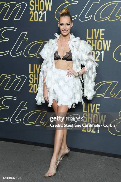 Maëva Coucke attends the Etam Womenswear Spring/Summer 2022 show as part of Paris Fashion Week at Opera Garnier on October 04, 2021 in Paris, France.