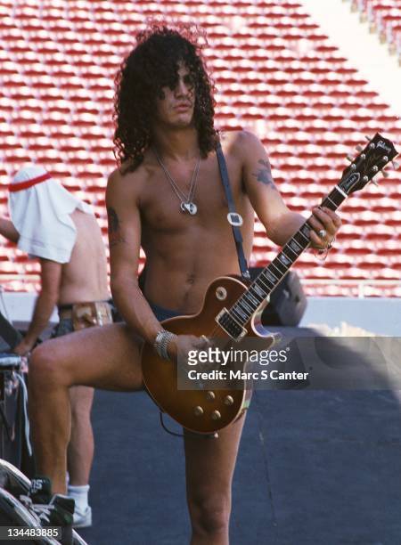 Guitarist Slash of the rock group 'Guns n' Roses' plays a Gibson Les Paul electric guitar during soundcheck as they get ready to open for Aerosmith...