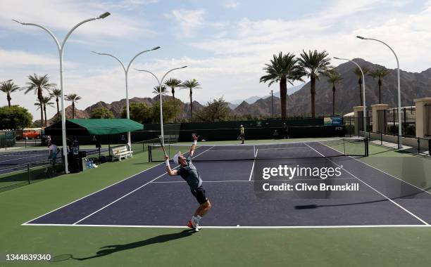 Andy Murray of Great Britain serves to John Millman of Australia during practice on Day 1 of the BNP Paribas Open at the Indian Wells Tennis Garden...