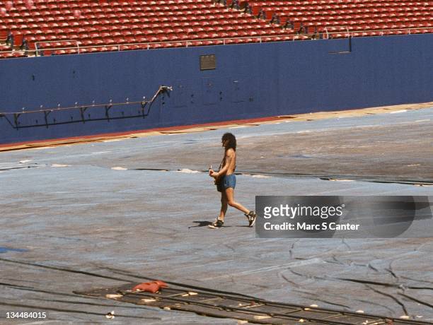 Guitarist Slash of the rock group 'Guns n' Roses' walks the stadium during soundcheck as they get ready to open for Aerosmith and Deep Purple as they...