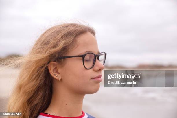 teen breathing deeply with eyes closed - bottomless girls stockfoto's en -beelden