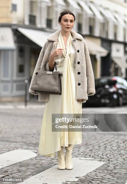 Mary Leest is seen wearing a Fendi dress, Fendi boots and bag with a Zadig & Voltaire coat during Paris Fashion Week S/S 2022 on October 04, 2021 in...