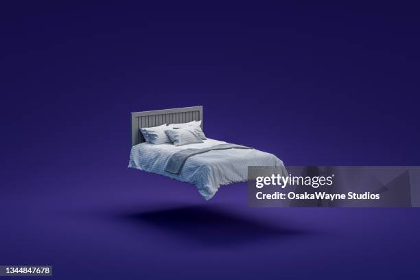 large double bed with pillows mid air - comfy bed stock pictures, royalty-free photos & images