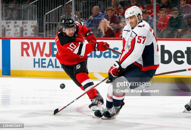Trevor van Riemsdyk of the Washington Capitals blocks a second period shot by Alexander Holtz of the New Jersey Devils in a preseason game at the...