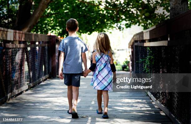 sibling walk - brother sister stock pictures, royalty-free photos & images