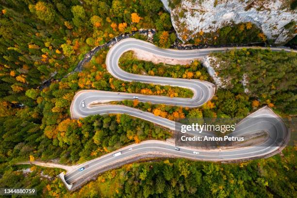 aerial view of a mountain road in autumn. romania, transylvania - alps romania stock pictures, royalty-free photos & images