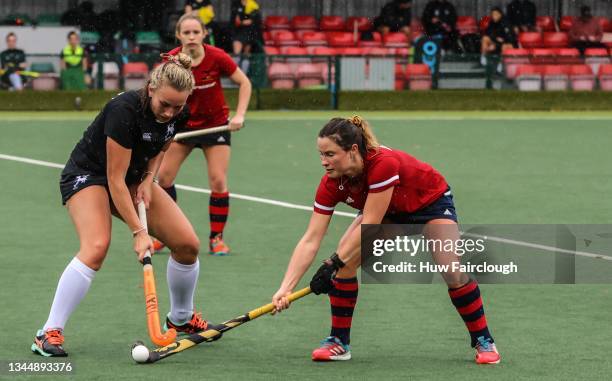 Pippa Barnes of Penarth Ladies challenges Katie Oliver of Witney during the Women's National Hockey League match between Penarth and Witney on...