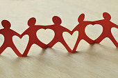 Paper people chain with hearts - Teamwork and love concept