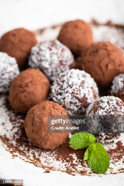 chocolate and coconut truffles on plate - chocolate truffle bildbanksfoton och bilder