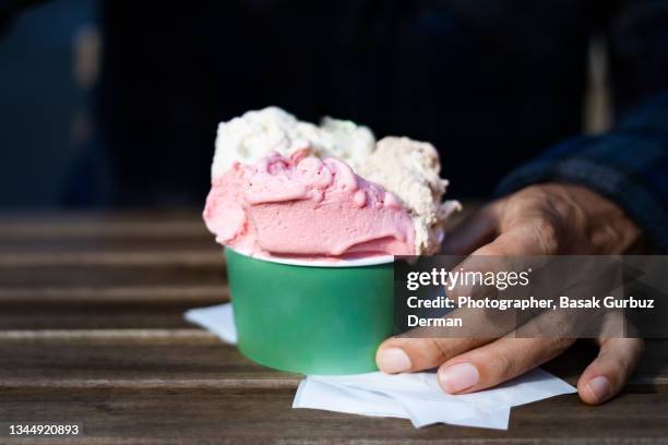 a man eating ice cream - gelato stock-fotos und bilder