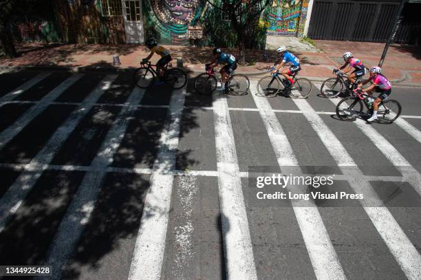 Participants pass through the Perseverancia neighborhood during the last stage finals of the Vuelta a Colombia Femenina 2021 in Bogota, Colombia,...