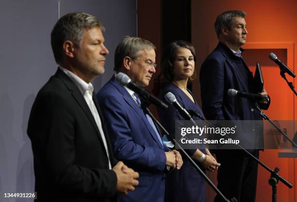 German Greens Party co-leaders Robert Habeck and Annalena Baerbock, German Christian Democrats head Armin Laschet and Christian Social Union of...
