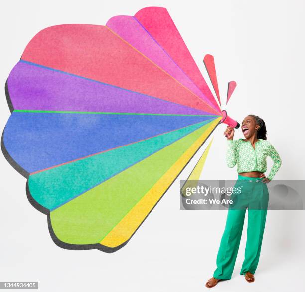 woman with megaphone and colourful shapes - multi coloured megaphone stock pictures, royalty-free photos & images