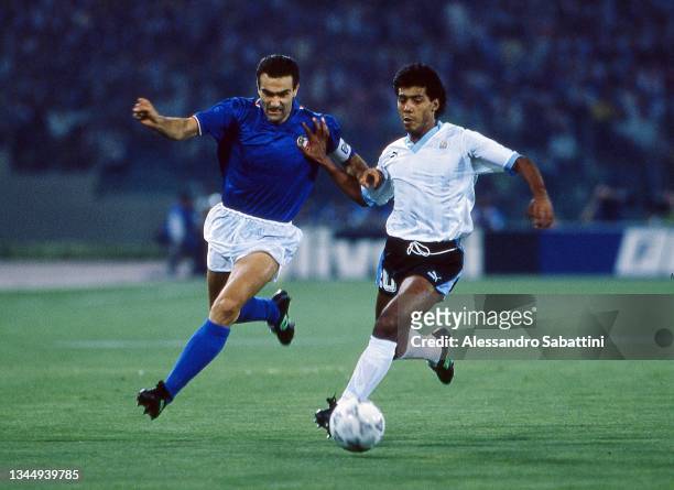 Giuseppe Bergomi of Italy competes for the ball with Ruben Paz of Uruguay during the World Cup 1990 match between Italy and Uruguay on 25 June in...