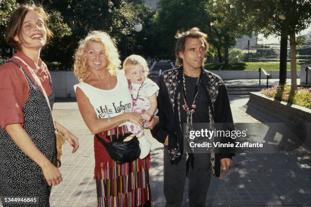 Rebecca Broussard, Nils Lofgren with his wife Amy, holding Lorraine Nicholson, at the Los Angeles Children's Museum in Los Angeles, California, US,...