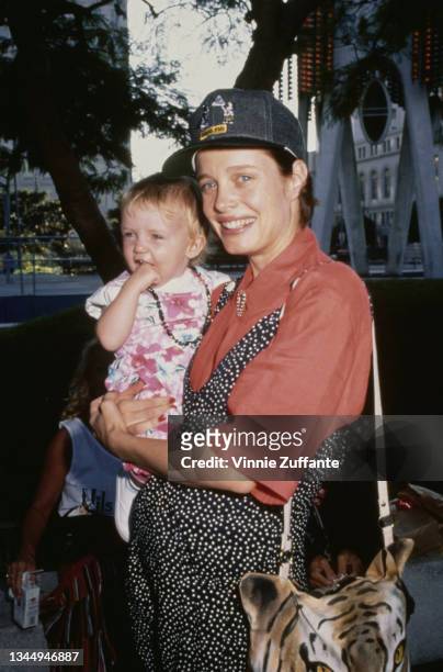 Rebecca Broussard holding Lorraine Nicholson at the Los Angeles Children's Museum in Los Angeles, California, US, September 29, 1990.