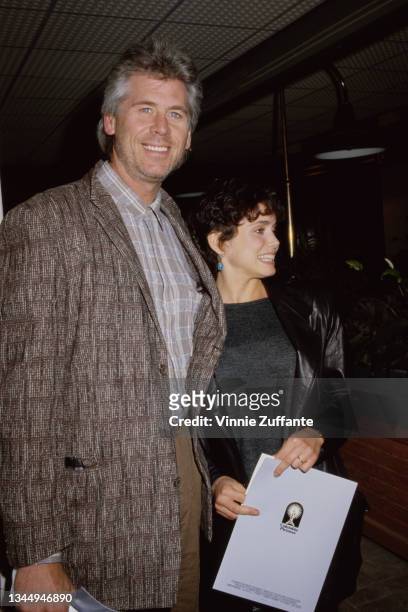 Barry Bostwick with Stacey Nelkin at the premiere of Empire of the Sun in Los Angeles, California, 1987.