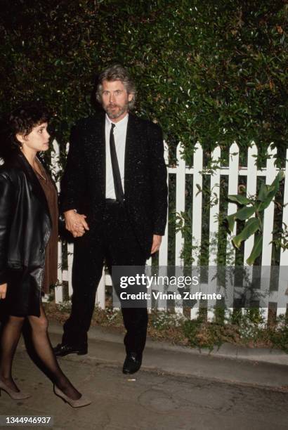 Actors Barry Bostwick with Stacey Nelkin attend an event, circa 1987.