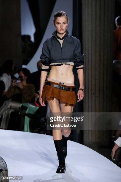 Model walks the runway during the Miu Miu Womenswear Spring/Summer 2022 show as part of Paris Fashion Week on October 05, 2021 in Paris, France.