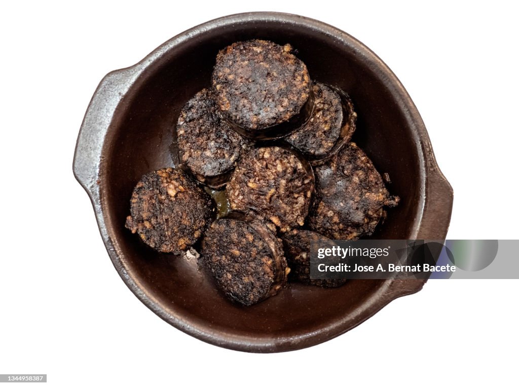 Plate of fried (morcilla) or blood sausage on a white background.