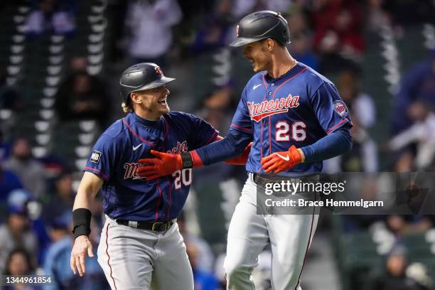 Max Kepler of the Minnesota Twins celebrates a home run with Josh Donaldson against the Chicago Cubs on September 22, 2021 at Wrigley Field in...