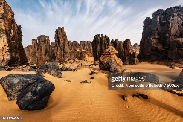 panoramic view of rock formations against sky,tamanrasset,algeria - algeria foto e immagini stock