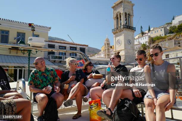 Holiday-makers on board a tourist ferry on October 05, 2021 in Hydra, Greece. Since the travel restrictions put in place during the height of the...