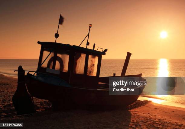 traditional fishing boat at sunset on the beach of usedom, germany - usedom fotografías e imágenes de stock