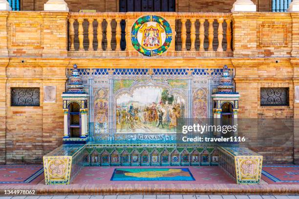 public bench with the city of granada on it in the plaza de espana, sevilla, spain. - granada province stock pictures, royalty-free photos & images