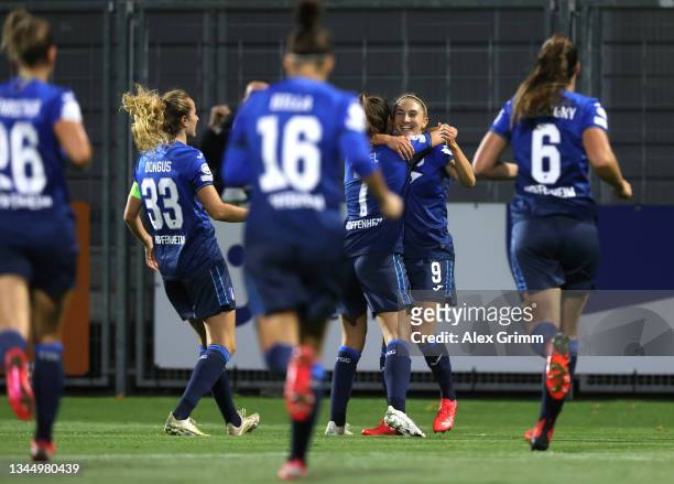 Katharina Naschenweng of TSG 1899 Hoffenheim is congratulated after scoring the opening goal during the UEFA Women's Champions League group C match...