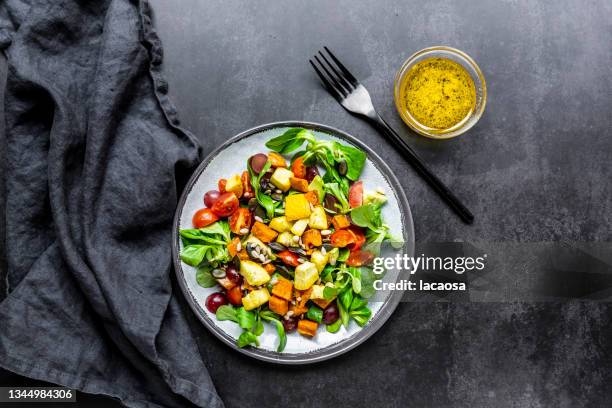 autumn salad with lamb's lettuce, sweet potato, zucchini, tomatoes and avocado - low carb diet stock pictures, royalty-free photos & images