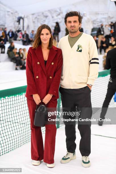 Charlotte Gabris and Antoine Benneteau attend the Lacoste Womenswear Spring/Summer 2022 show as part of Paris Fashion Week on October 05, 2021 in...