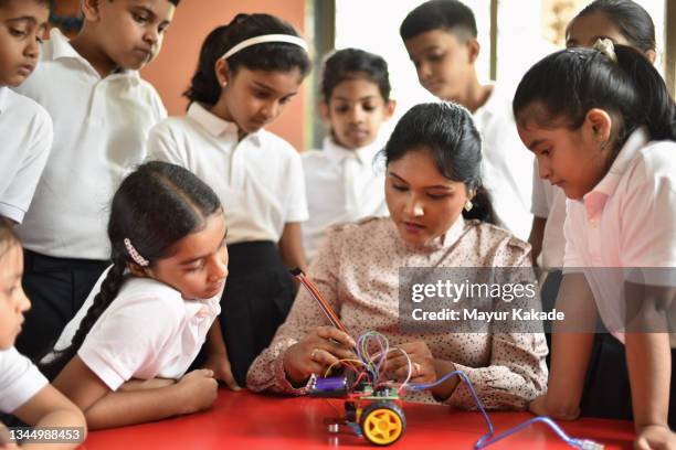 teacher teaching students robotics in school - classroom india stock pictures, royalty-free photos & images