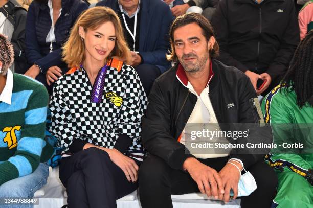 Louise Bourgoin and Thierry Guibert attend the Lacoste Womenswear Spring/Summer 2022 show as part of Paris Fashion Week on October 05, 2021 in Paris,...