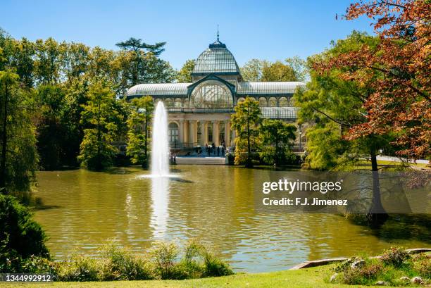 landscape of the city of madrid with the crystal palace in el retiro park, spain - parque del buen retiro stock pictures, royalty-free photos & images
