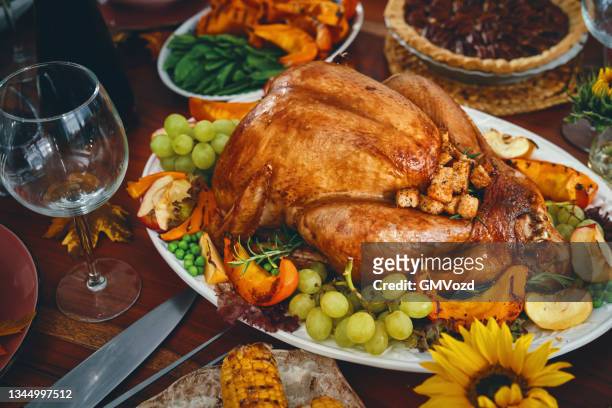 stuffed turkey for thanksgiving holidays with pumpkin, peas, pecan pie and other ingredient - fylld kalkon bildbanksfoton och bilder