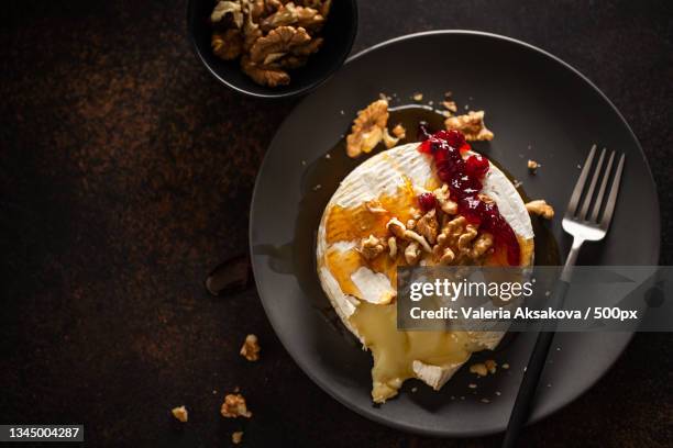 high angle view of dessert in plate on table - camembert stock-fotos und bilder