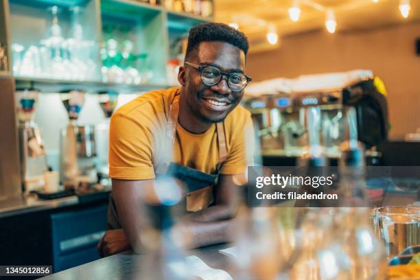 portrait of happy bartender - bar reopening stock pictures, royalty-free photos & images