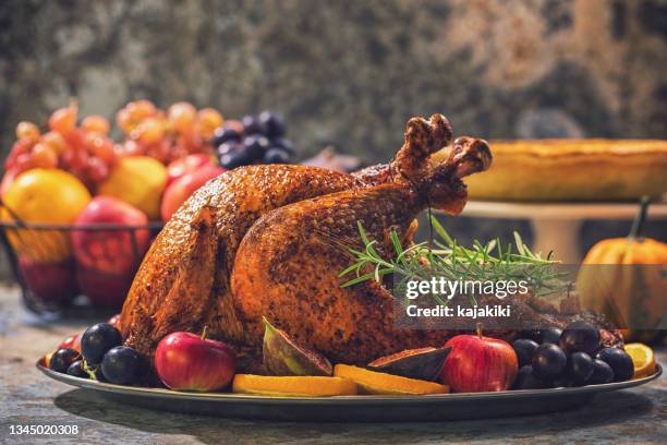 preparing stuffed turkey with side dishes for holidays - fylld kalkon bildbanksfoton och bilder